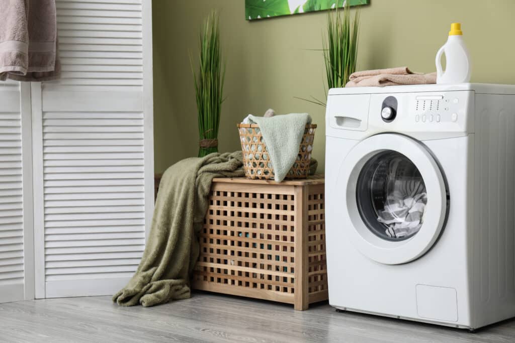 Interior of home laundry room with modern washing machine